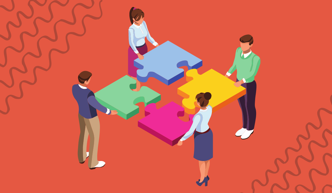 Team putting together puzzle peices
